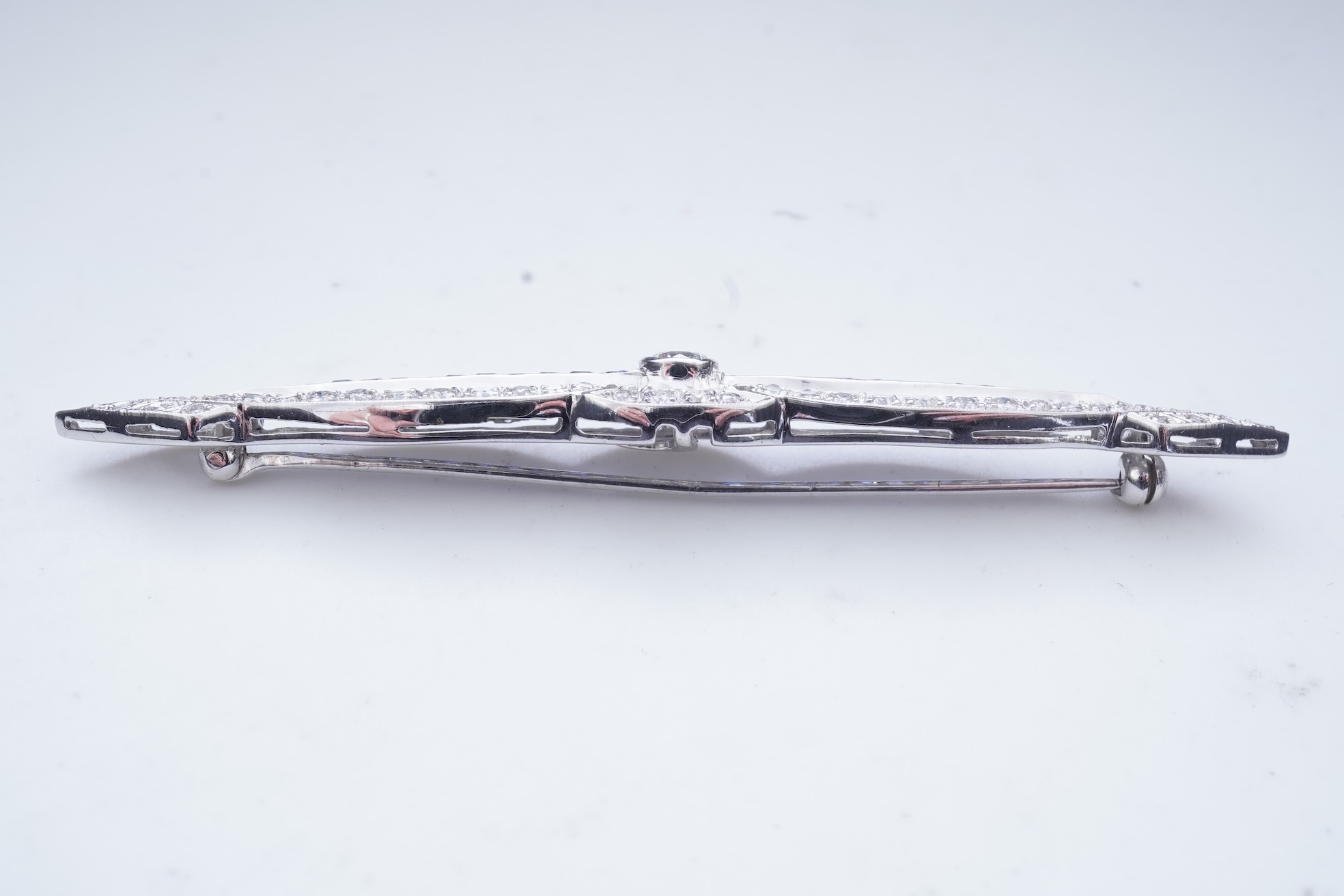 A sapphire and diamond bar brooch